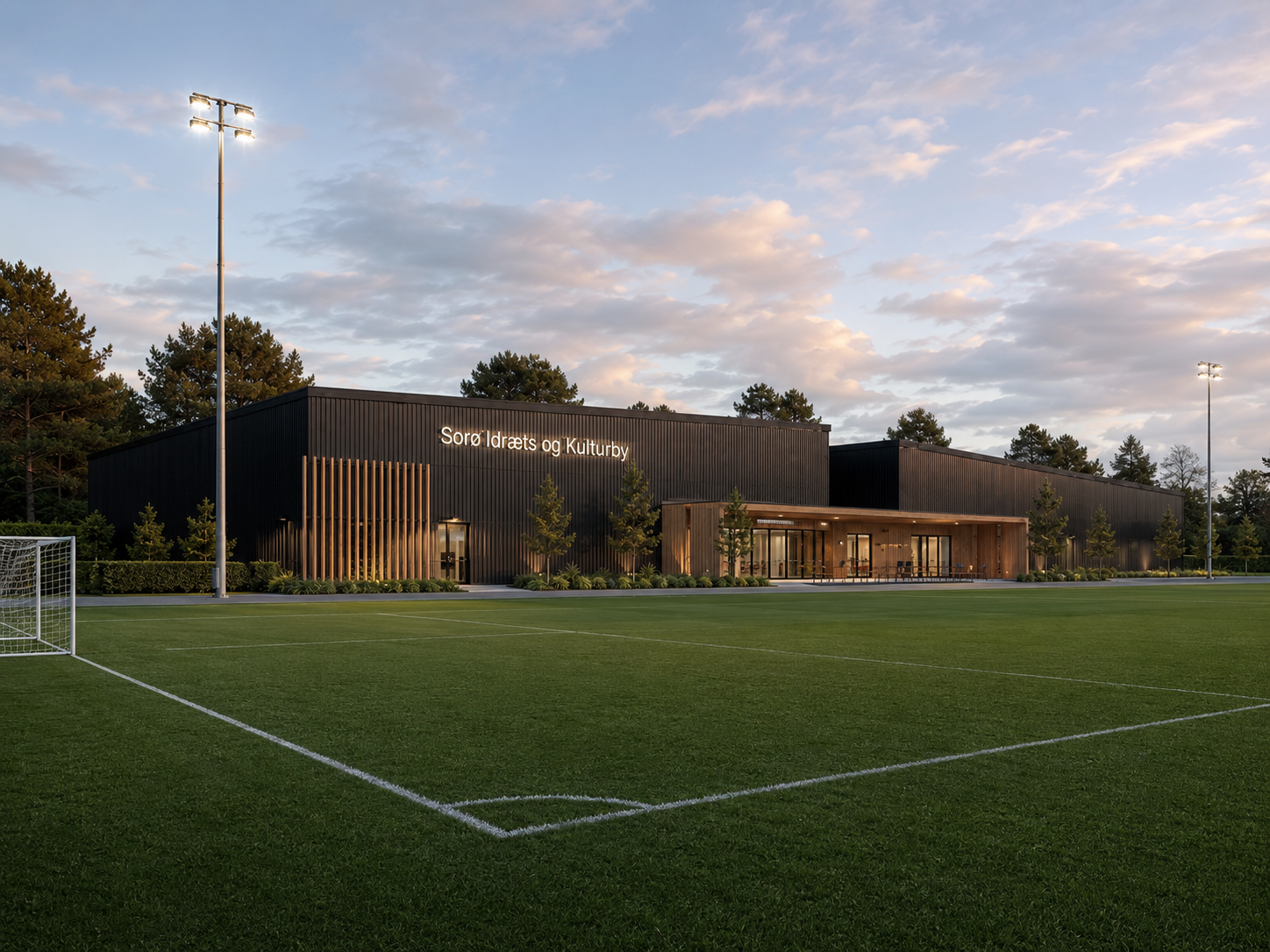 Visualisering af Sorø Idræts- og Kulturby ved solnedgang set fra fodboldbanen